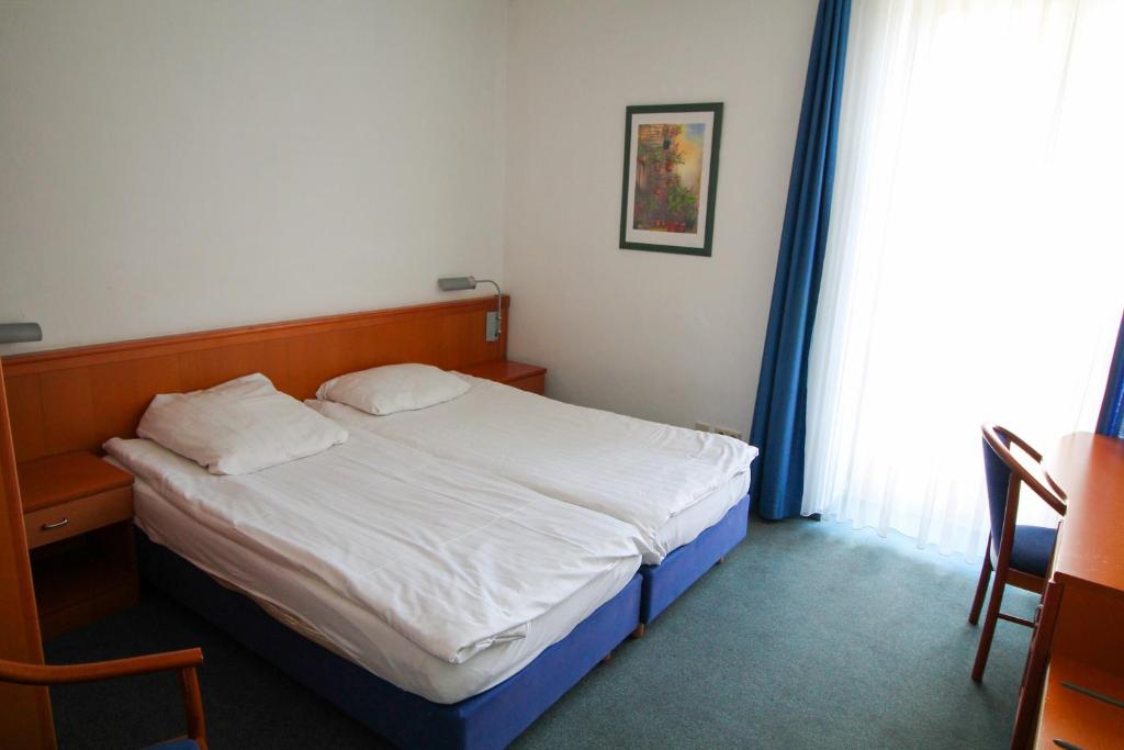 Postel nebo postele na pokoji v ubytování Hotel Ahrberg Viertel