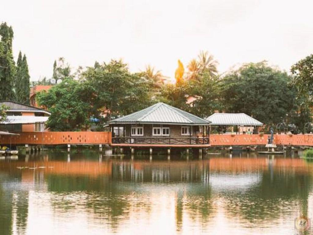 a house on a bridge over a body of water at Hans Cottage Botel in Cape Coast