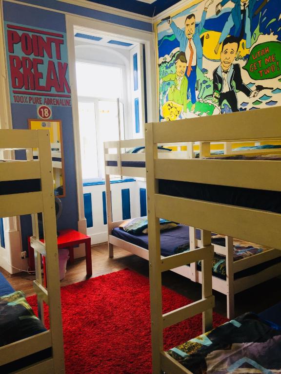 Postel nebo postele na pokoji v ubytování The Paintshop Hostel
