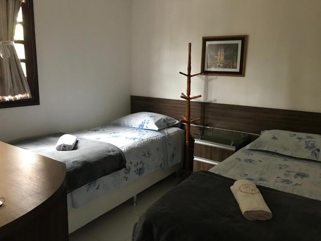 Postel nebo postele na pokoji v ubytování Chalé no Condomínio Serra Nevada I