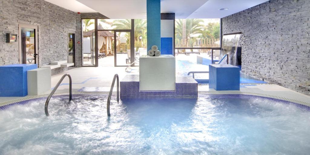 a hot tub in the middle of a building at Barceló Corralejo Bay - Adults Only in Corralejo