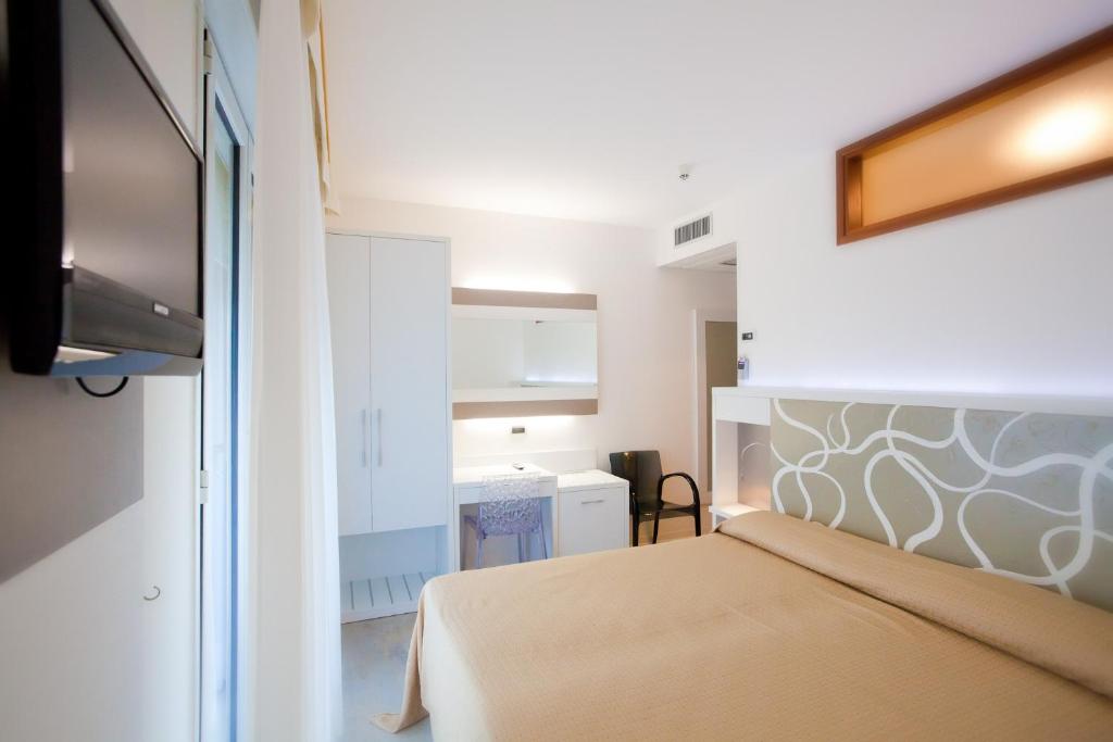 Postel nebo postele na pokoji v ubytování Hotel Savoy