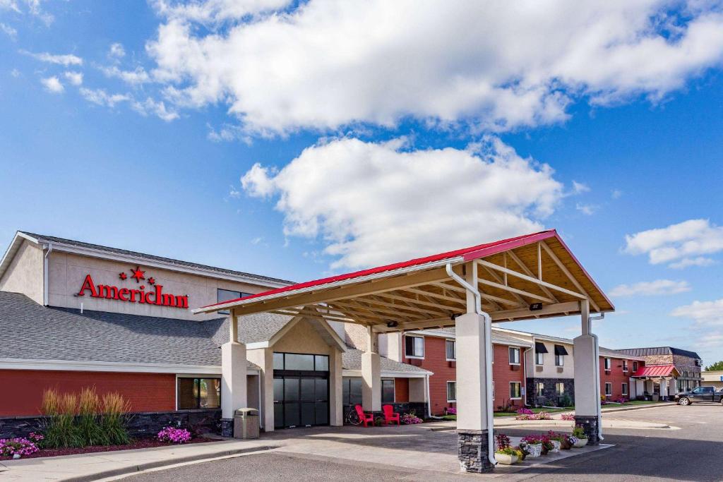 a building with a american sign on the side of it at AmericInn by Wyndham Virginia in Virginia