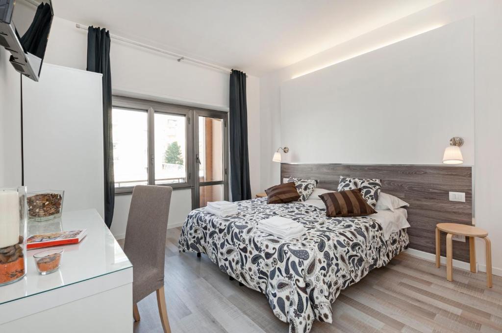 A bed or beds in a room at De Guestibus