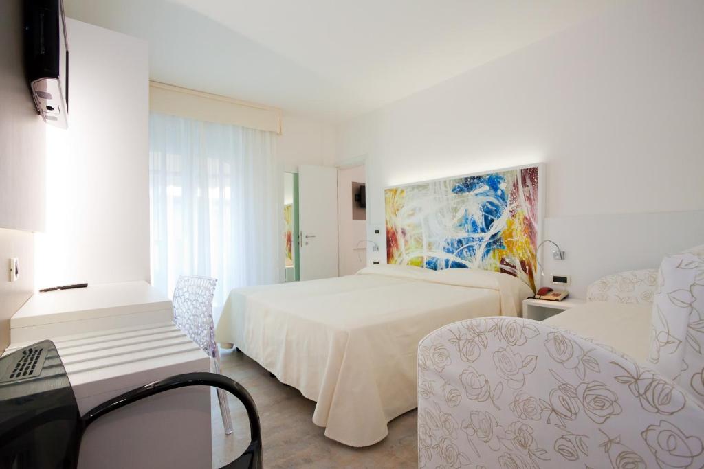 Postel nebo postele na pokoji v ubytování Hotel Savoy