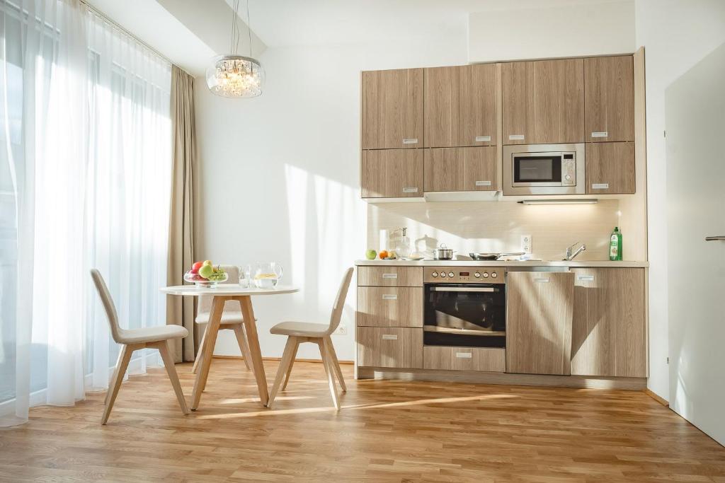 Kuchyň nebo kuchyňský kout v ubytování Oliver Apartments | contactless check-in