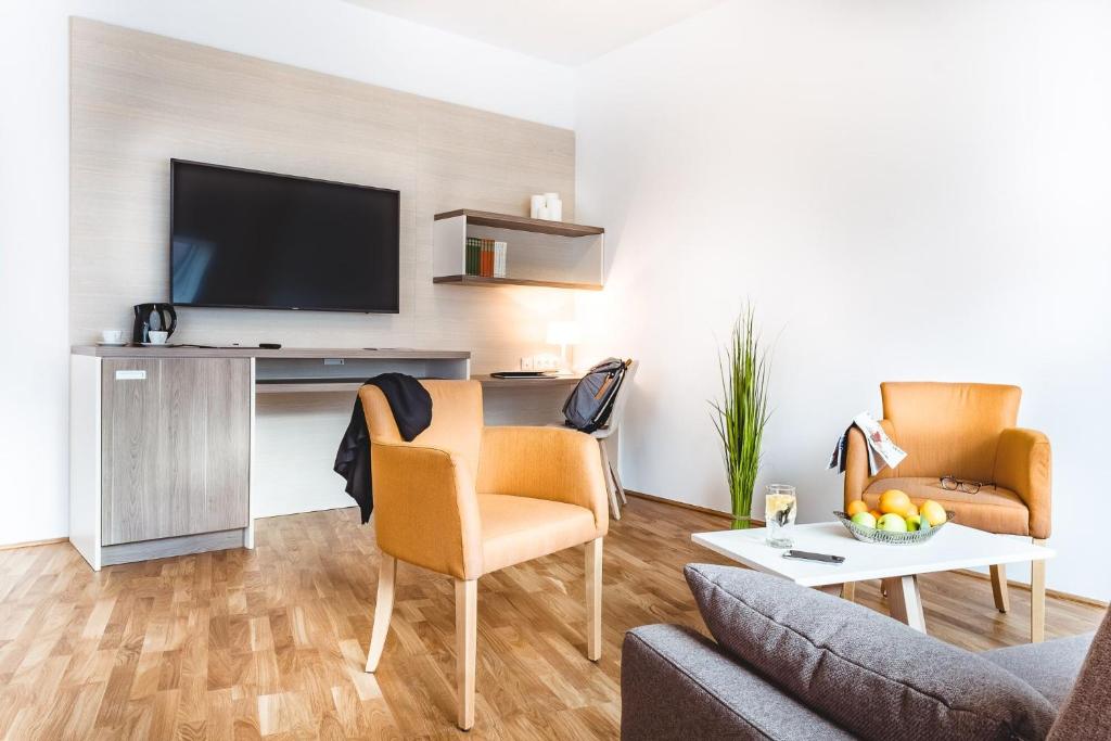 TV a/nebo společenská místnost v ubytování Oliver Apartments | contactless check-in