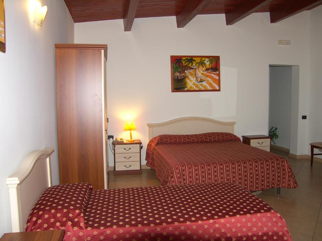 Postel nebo postele na pokoji v ubytování Hotel Genius