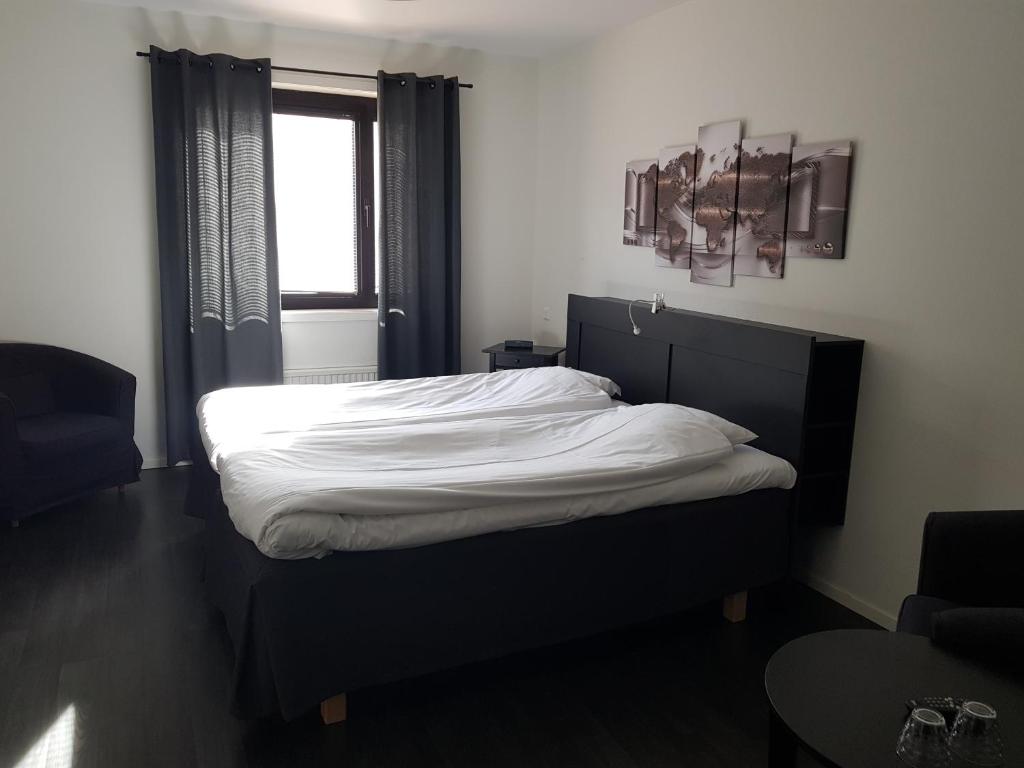 Postel nebo postele na pokoji v ubytování Centralhotellet