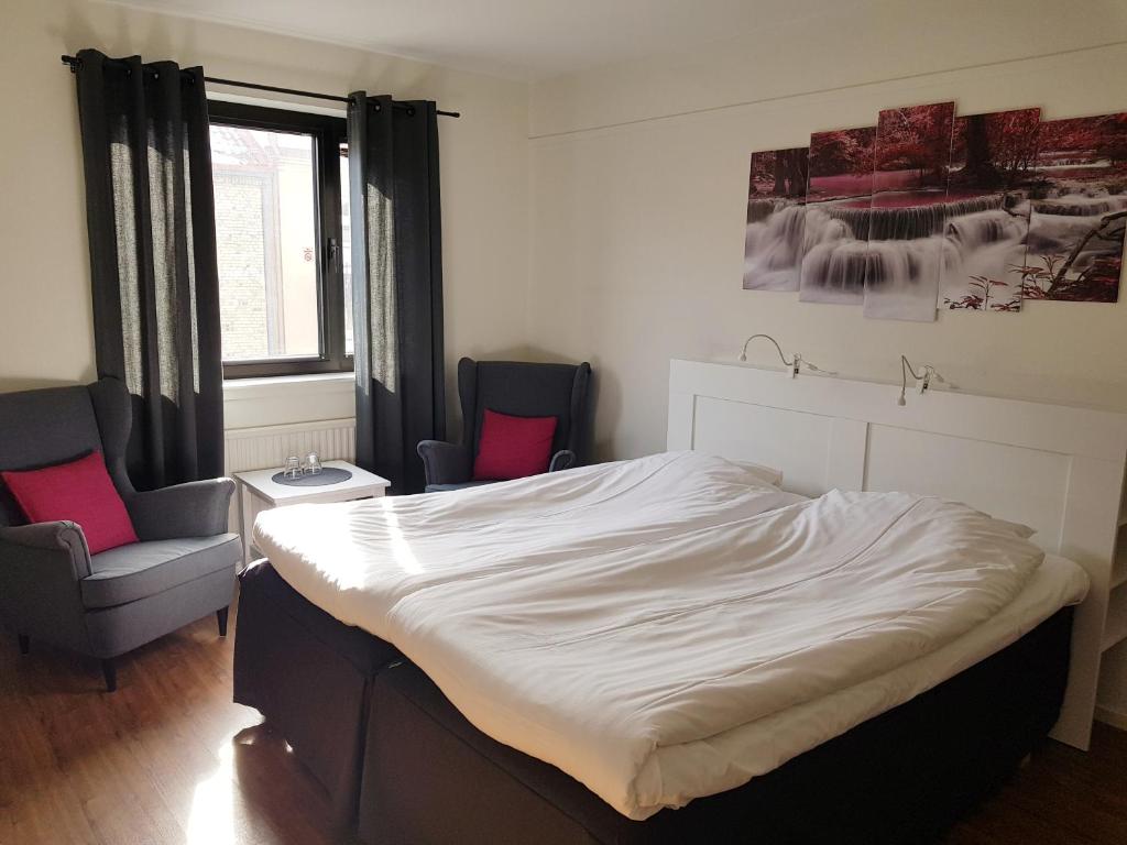 Postel nebo postele na pokoji v ubytování Centralhotellet