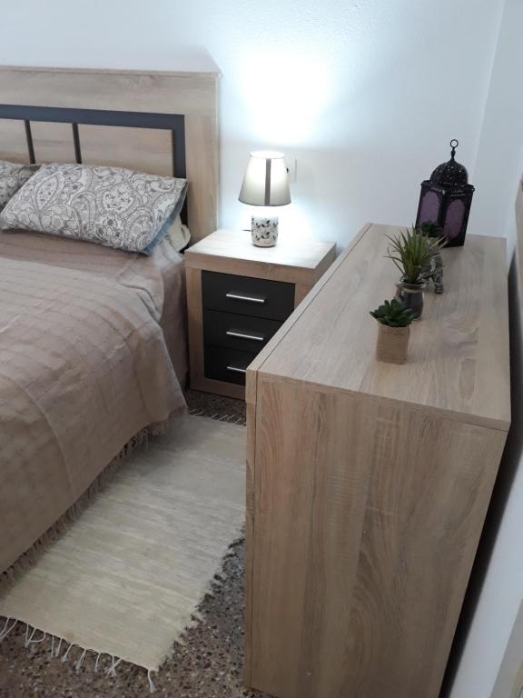 Łóżko lub łóżka w pokoju w obiekcie Apartamento Vacacional
