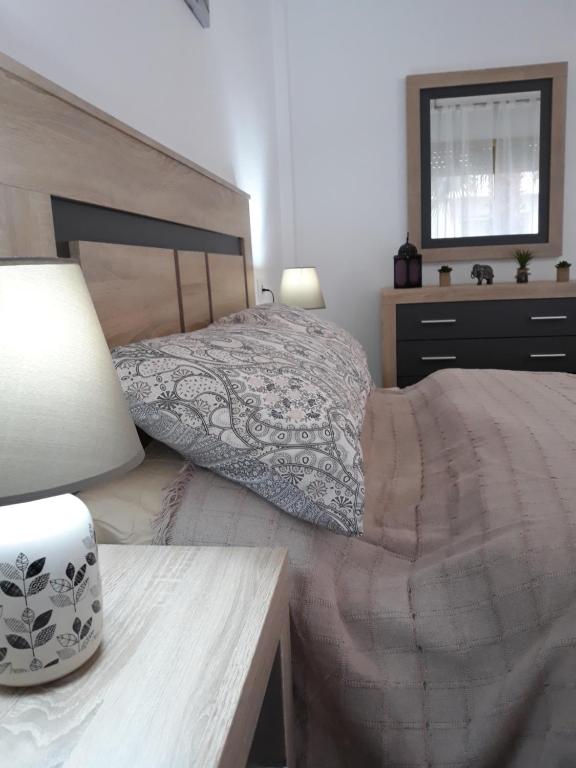 Łóżko lub łóżka w pokoju w obiekcie Apartamento Vacacional
