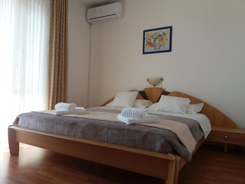 Postel nebo postele na pokoji v ubytování Guest House Lucija
