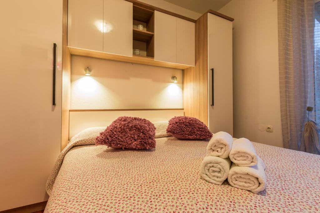 Postel nebo postele na pokoji v ubytování Apartments D&A