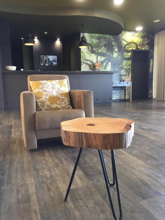 a living room with a couch and a coffee table at Hotel Euro Moniz in Porto Moniz