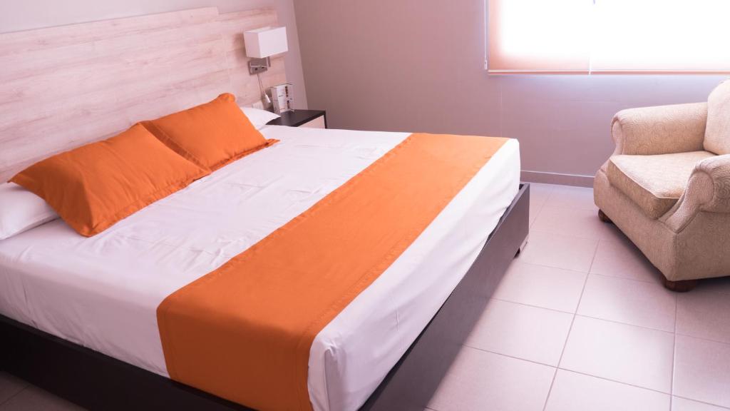 Postel nebo postele na pokoji v ubytování Hotel Los Almendros