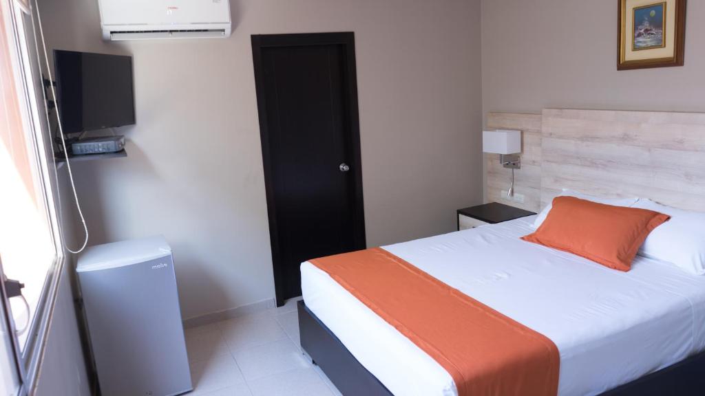 Postel nebo postele na pokoji v ubytování Hotel Los Almendros
