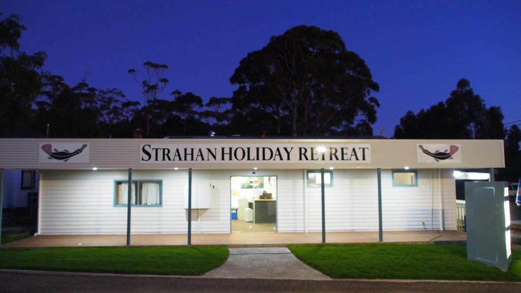 a building with a sign that reads st filian holiday retreat at Strahan Retreat Holiday Park in Strahan