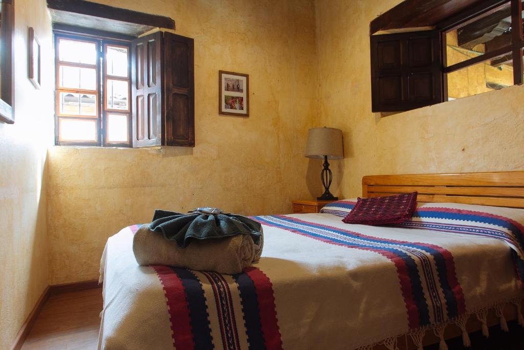 Postel nebo postele na pokoji v ubytování Posada del Abuelito (Hostel)