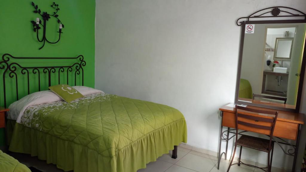 Postel nebo postele na pokoji v ubytování Hotel Posada Santo Niño