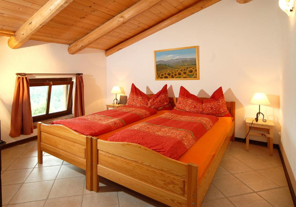 Postel nebo postele na pokoji v ubytování Agriturismo Sondrea