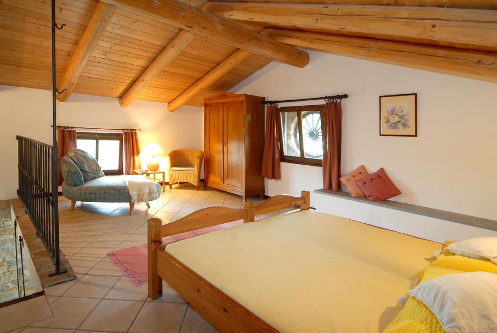 Postel nebo postele na pokoji v ubytování Agriturismo Sondrea