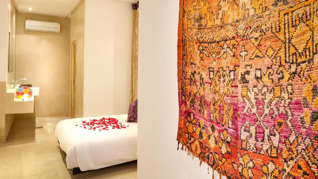 Postel nebo postele na pokoji v ubytování Ryad Marrakech