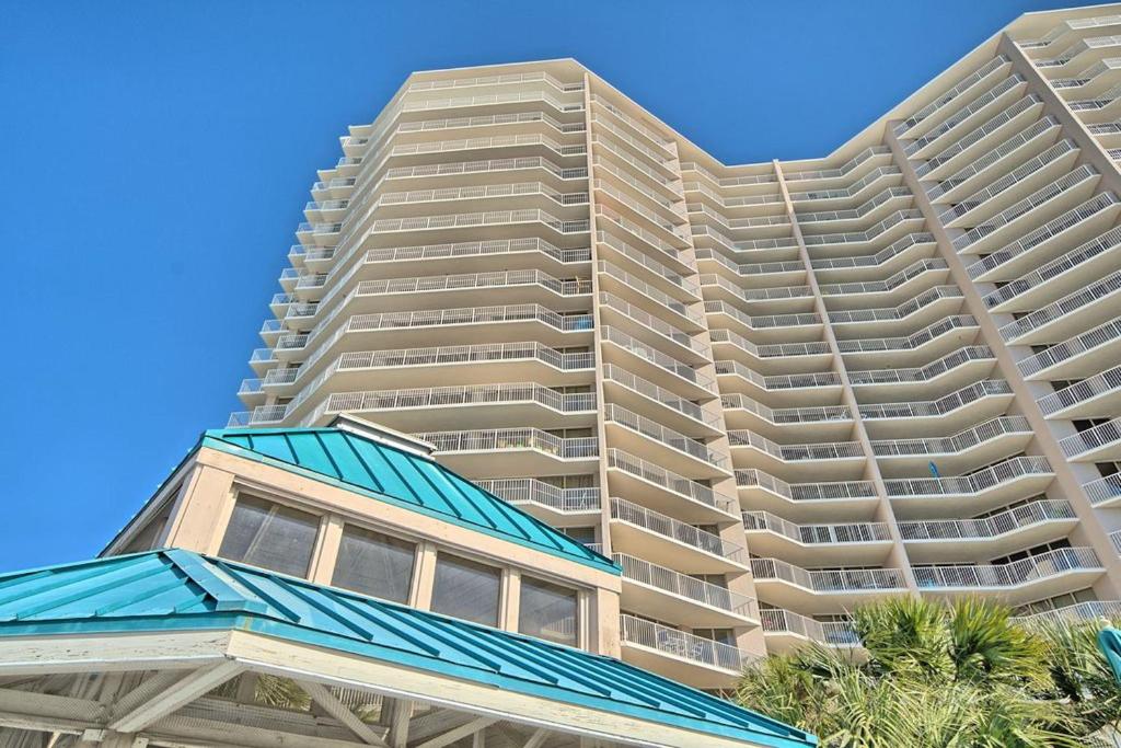 a large apartment building with a building at Dunes of Panama Condos in Panama City Beach