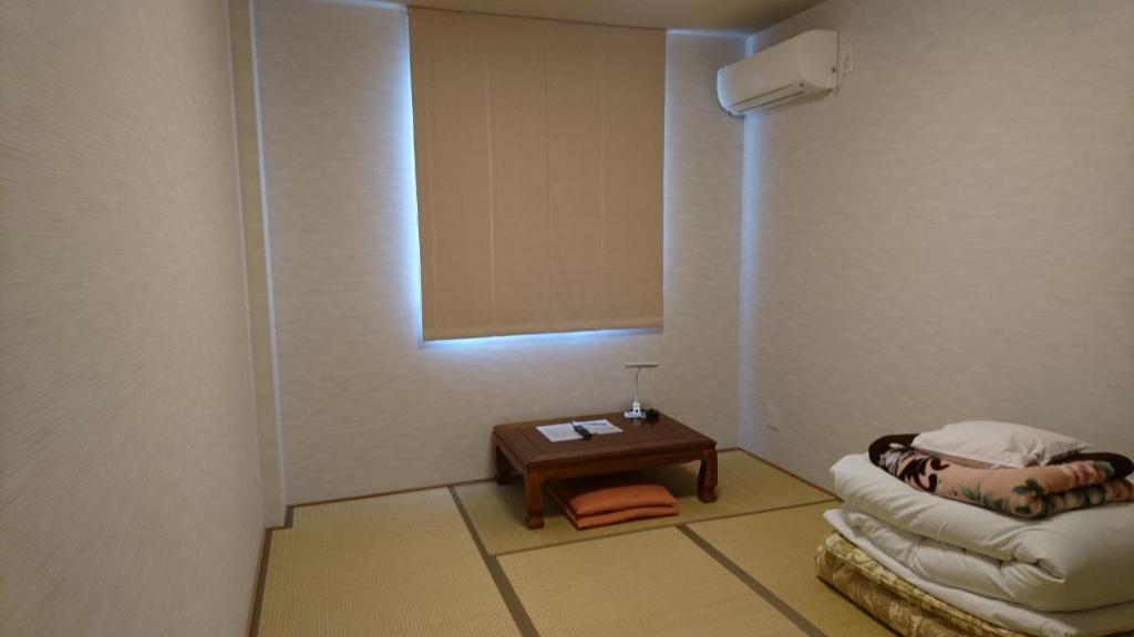 Postel nebo postele na pokoji v ubytování Hotel Taiheiyo