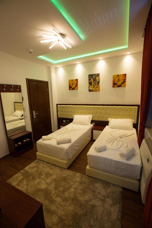 Postel nebo postele na pokoji v ubytování Hotel Palma