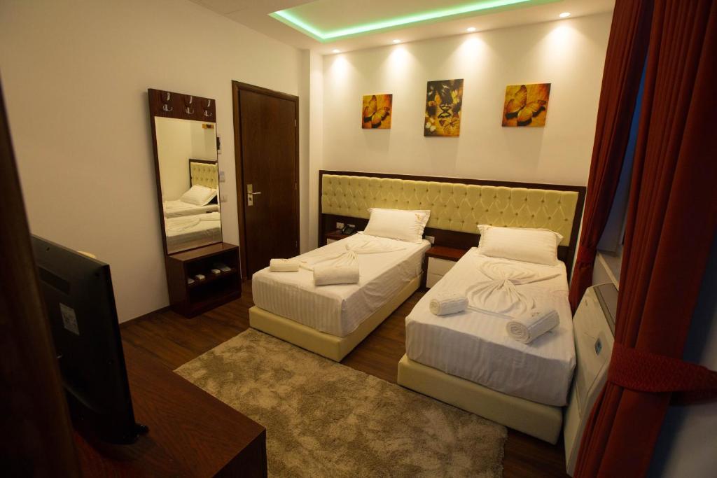 Postel nebo postele na pokoji v ubytování Hotel Palma
