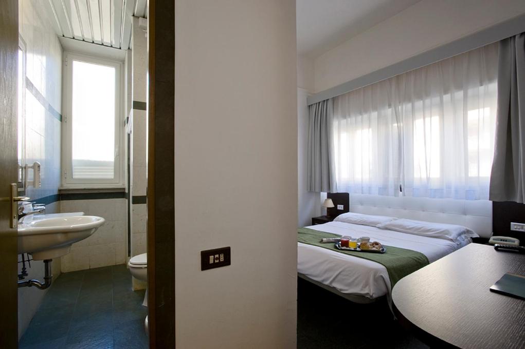Postel nebo postele na pokoji v ubytování Dipendenza Hotel Bellavista
