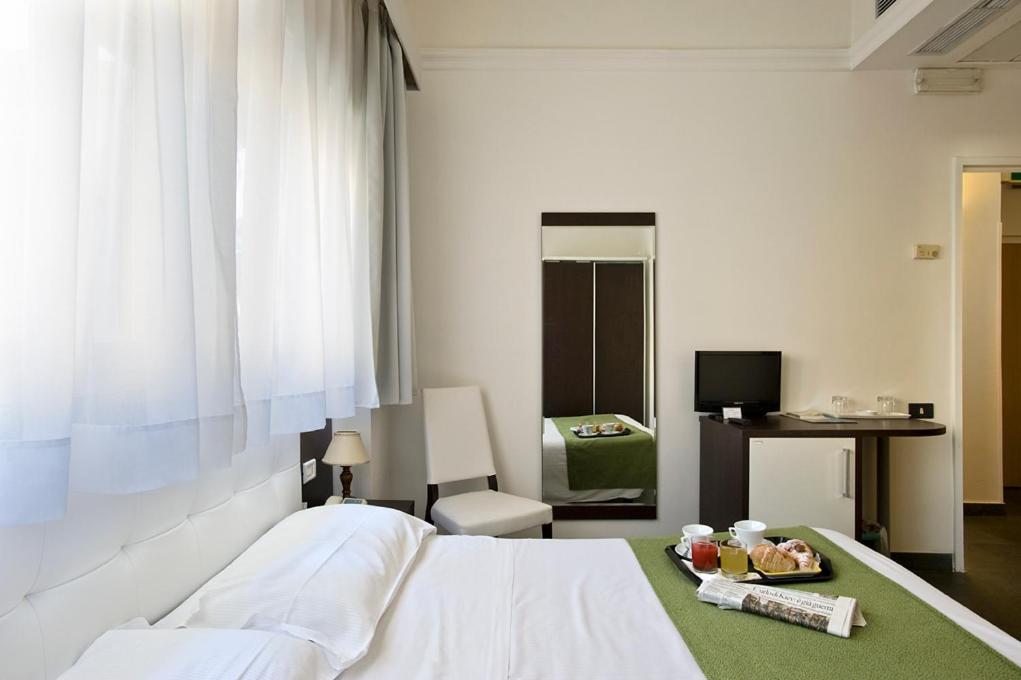 Postel nebo postele na pokoji v ubytování Dipendenza Hotel Bellavista