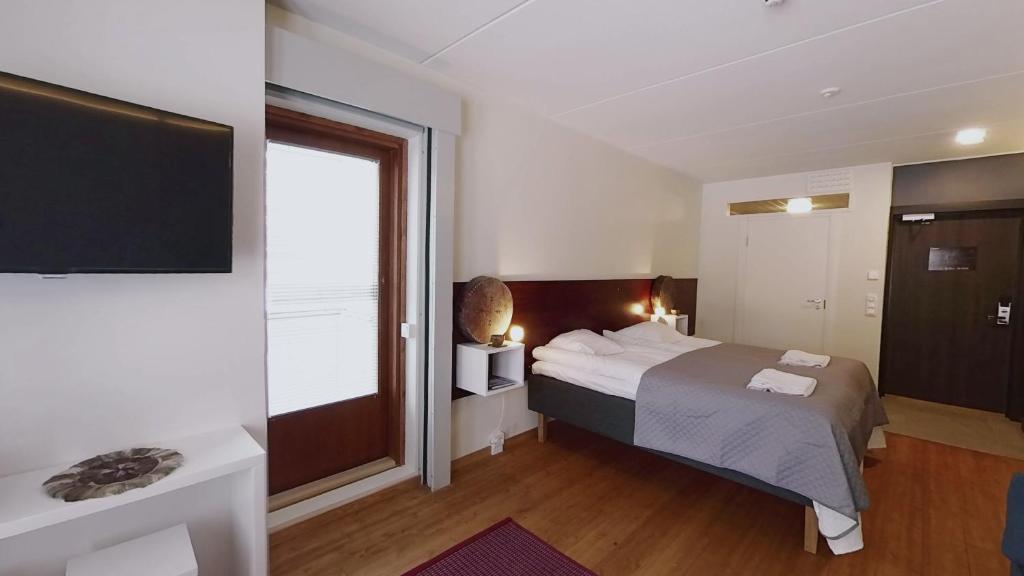 Кровать или кровати в номере Hotel Arctic Zone
