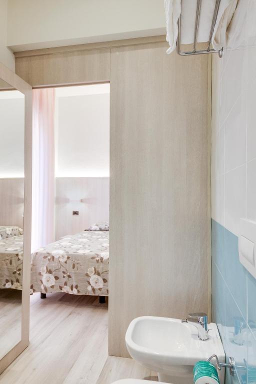 Postel nebo postele na pokoji v ubytování Hotel Barbiani