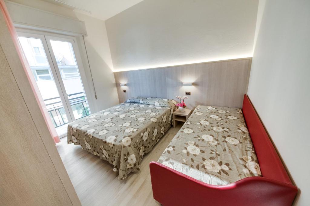 Postel nebo postele na pokoji v ubytování Hotel Barbiani