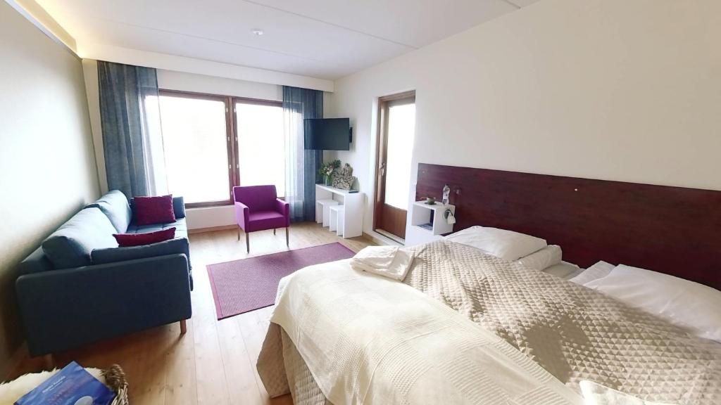Кровать или кровати в номере Hotel Arctic Zone