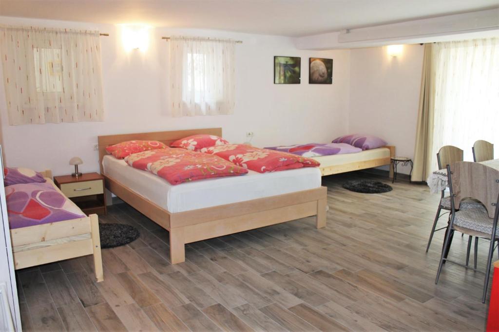 Postel nebo postele na pokoji v ubytování Rooms Jurca