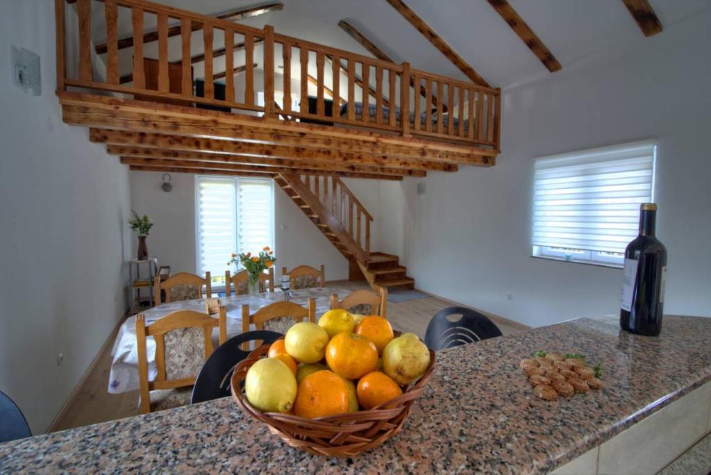 a bowl of fruit sitting on a counter in a kitchen at Tanja in Senj