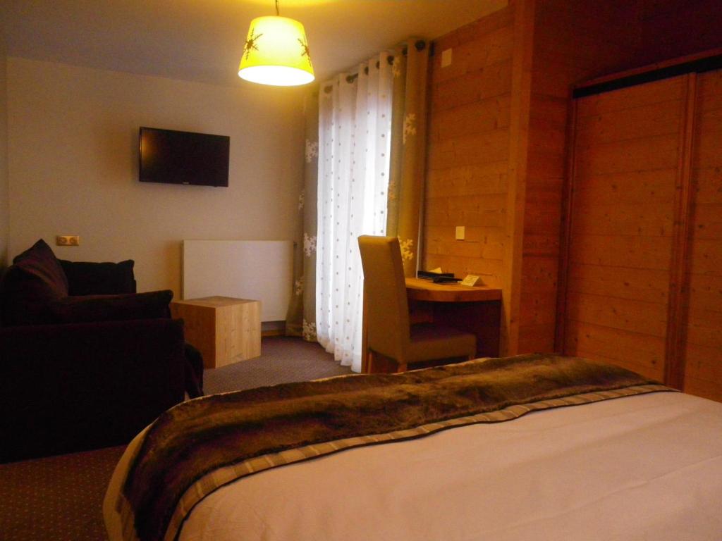 Postel nebo postele na pokoji v ubytování Hôtel L'Ensoleillé