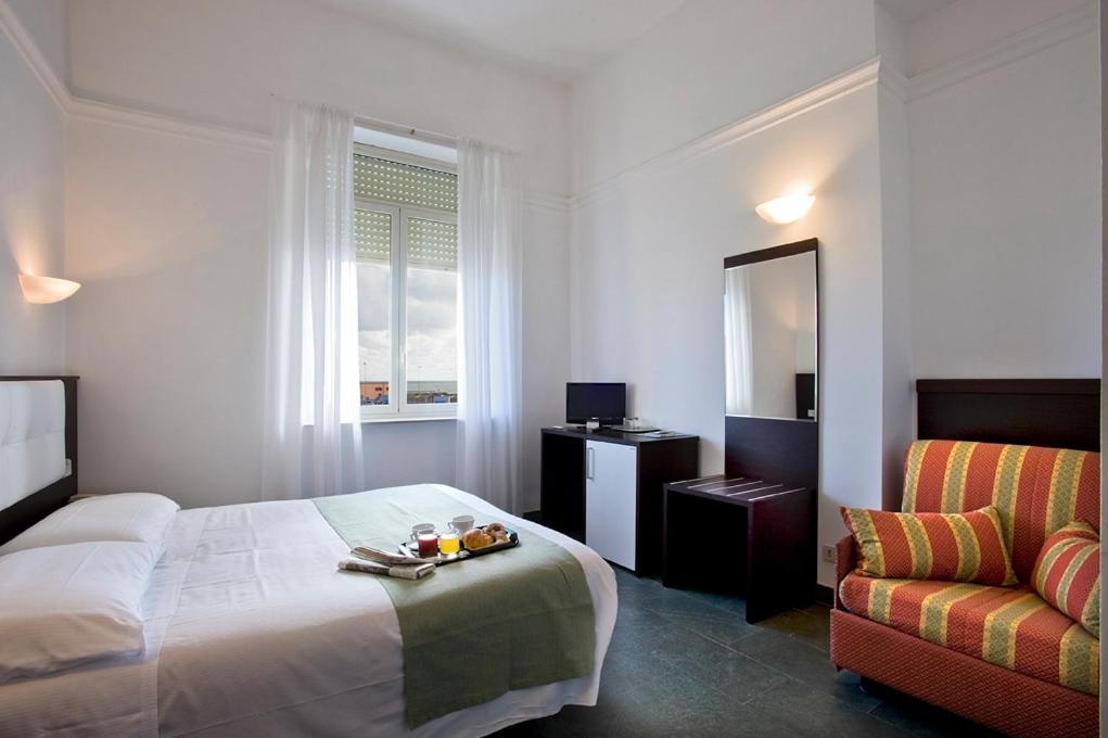 Postel nebo postele na pokoji v ubytování Dipendenza Hotel Bellavista