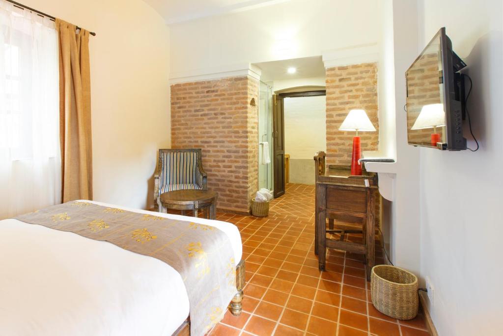 Postel nebo postele na pokoji v ubytování Thamel Villa Heritage Hotel