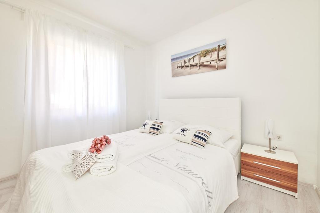 Łóżko lub łóżka w pokoju w obiekcie Apartments Gvarda