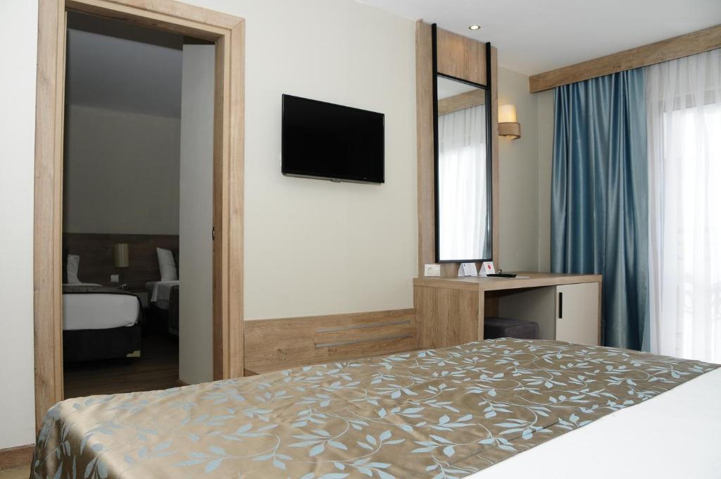 Postel nebo postele na pokoji v ubytování Lucida Beach Hotel - Ultra All Inclusive