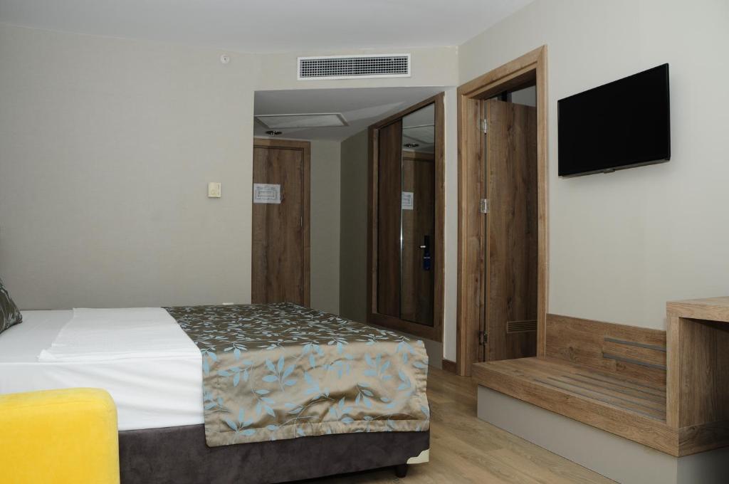 Postel nebo postele na pokoji v ubytování Lucida Beach Hotel - Ultra All Inclusive