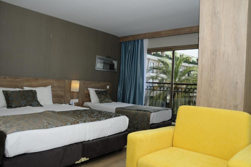 Postel nebo postele na pokoji v ubytování Lucida Beach Hotel - Ultra All Inclusive