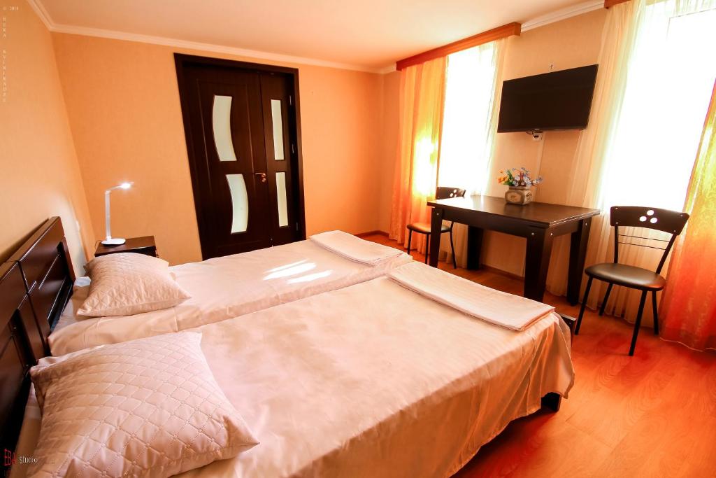 Postel nebo postele na pokoji v ubytování Green Garden Guest House
