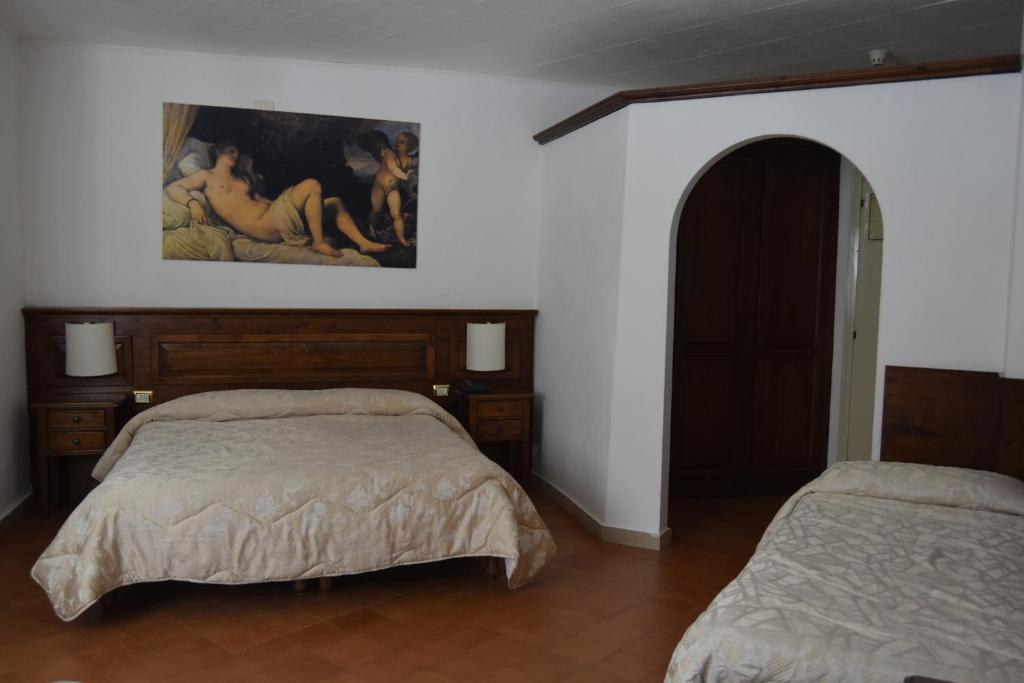 Postel nebo postele na pokoji v ubytování Albergo Del Sole
