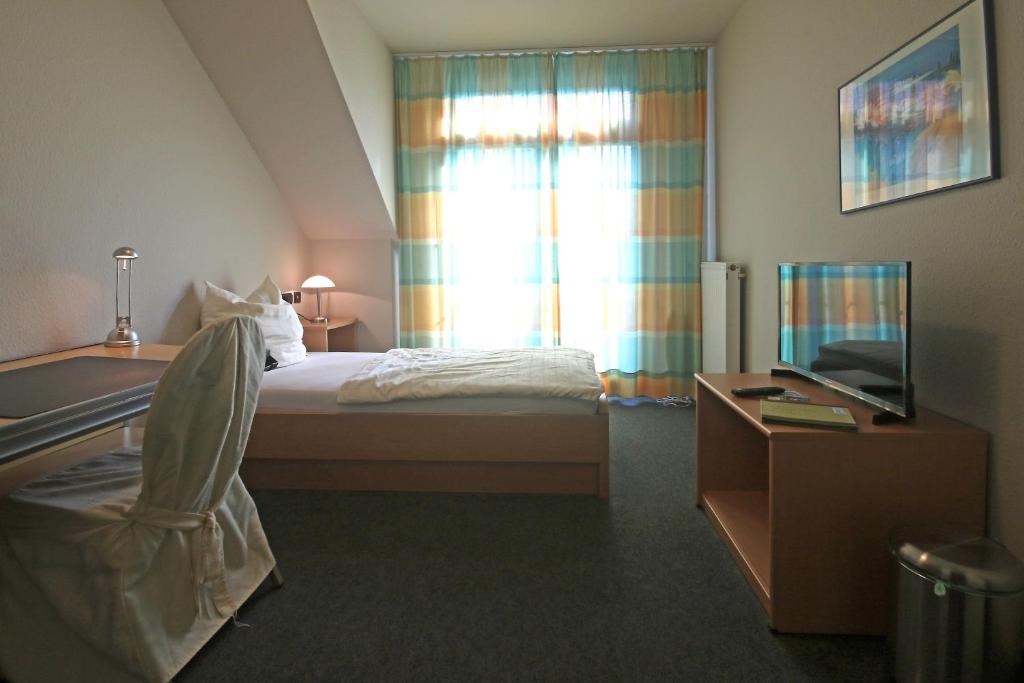Postel nebo postele na pokoji v ubytování Hotel Busch-Atter