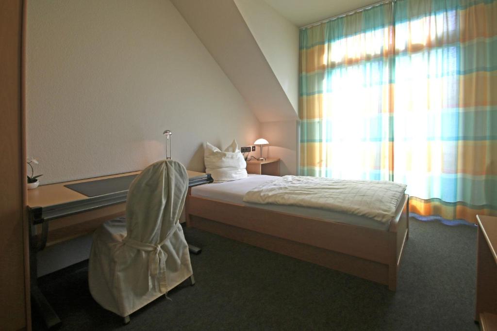 Postel nebo postele na pokoji v ubytování Hotel Busch-Atter